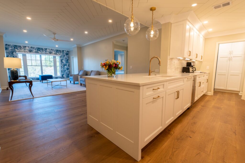 Spacious modern kitchen and living area with hardwood floors