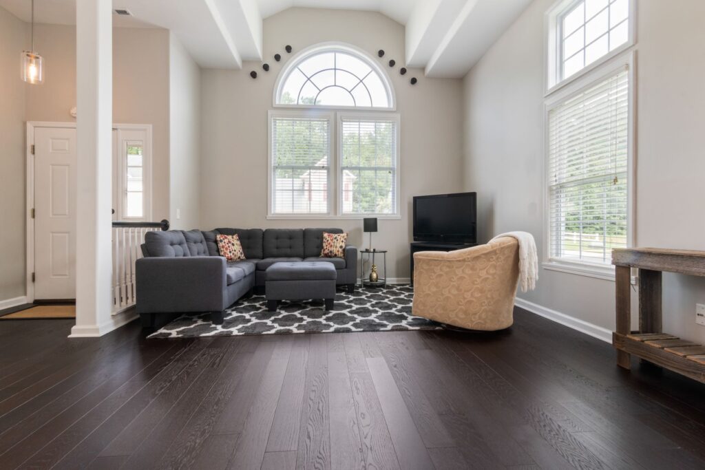Modern living room with high ceilings and large windows