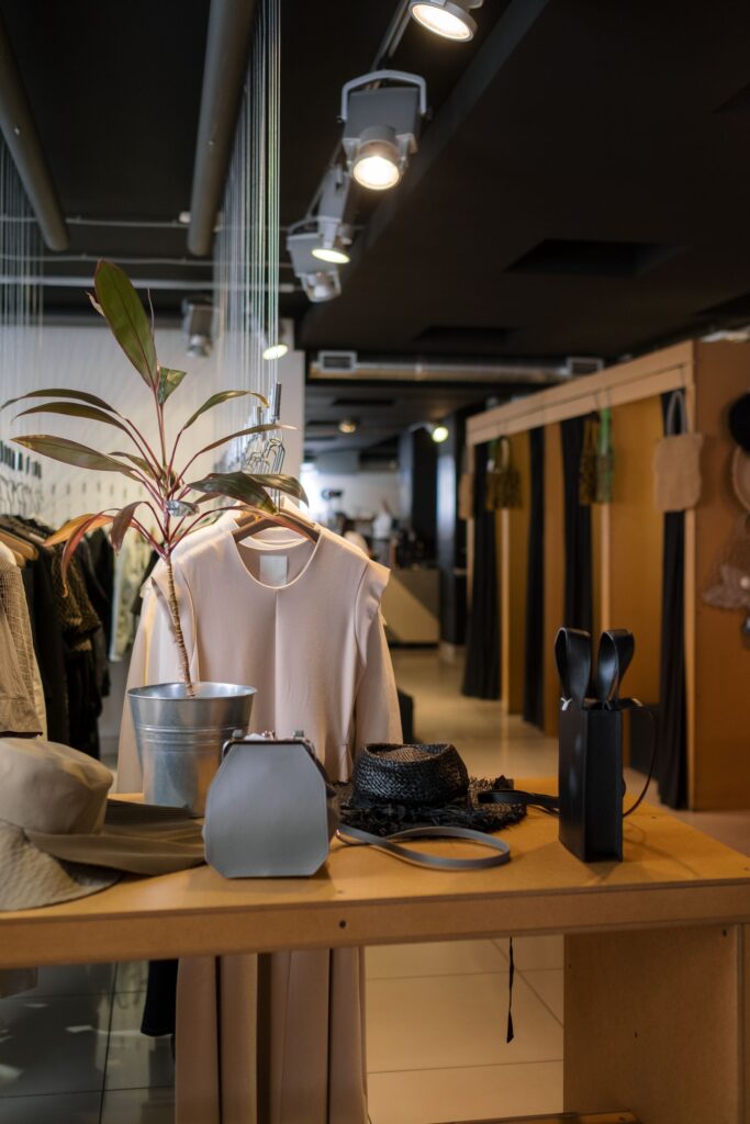 Modern clothing store with organized merchandise and lighting